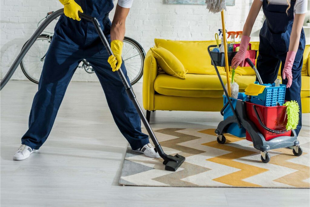 Начало 10 cropped view of cleaners in overalls cleaning apar 2024 11 18 08 59 53 XXJP3SX